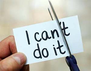 Man using scissors to remove the word can't to read I can do it